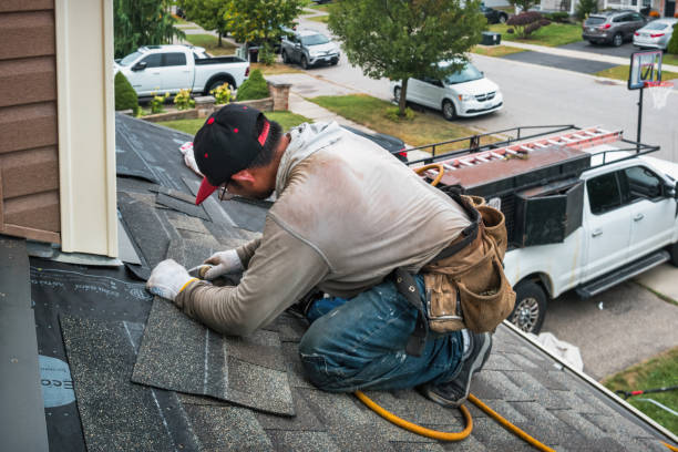 Professional Roof Replacement technician working in West Roxbury, MA